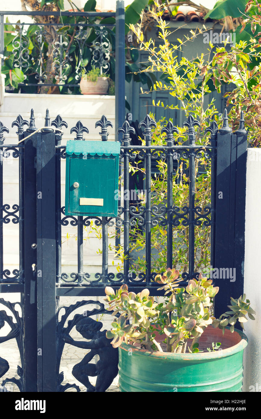 Iron gate with mailbox Stock Photo