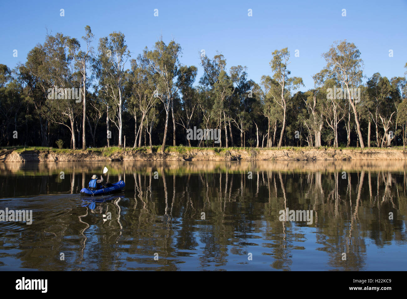 Senior woman kayaking on the Murray River at Bourkes Bend Victoria Australia Stock Photo