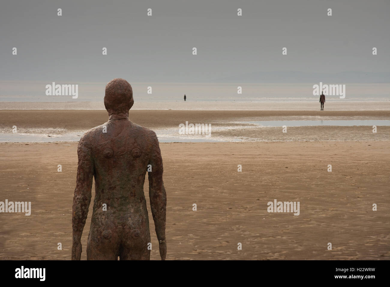 UK, Merseyside, Crosby, Crosby Beach, Anthony Gormley’s Another Place artwork - statues Stock Photo