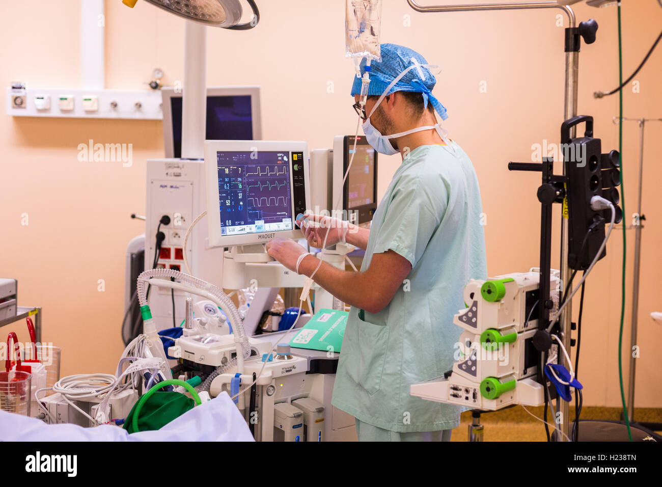 Surgical monitors being used to track the vital signs of a patient