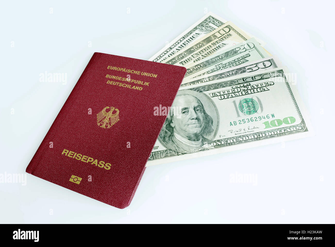 German passport and US dollar bills Stock Photo