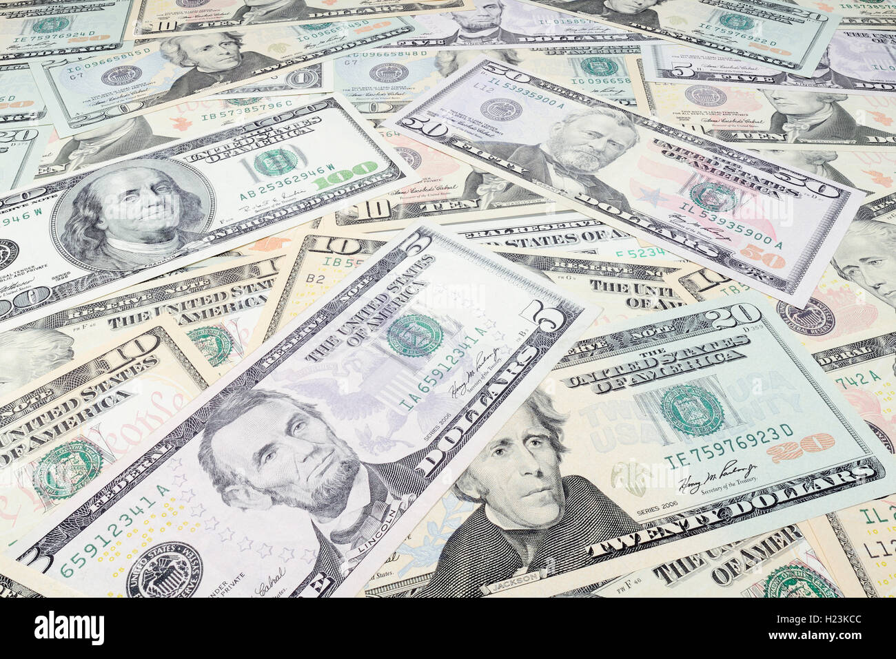 Various US dollar bills in a pile Stock Photo