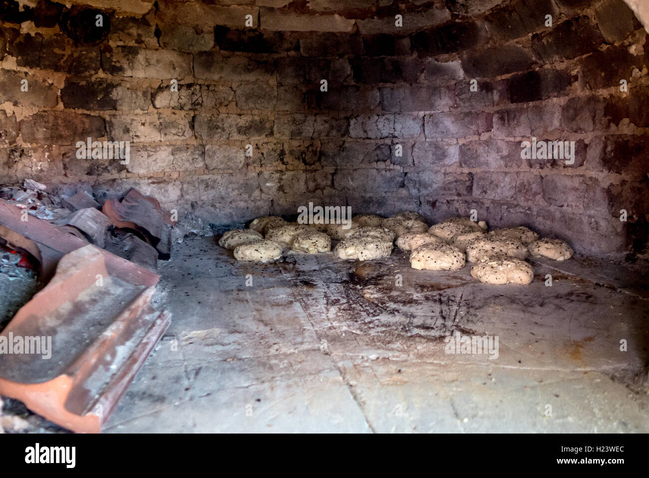 Traditional Turkish sesame seed bread rolls being baked freshly in a ...