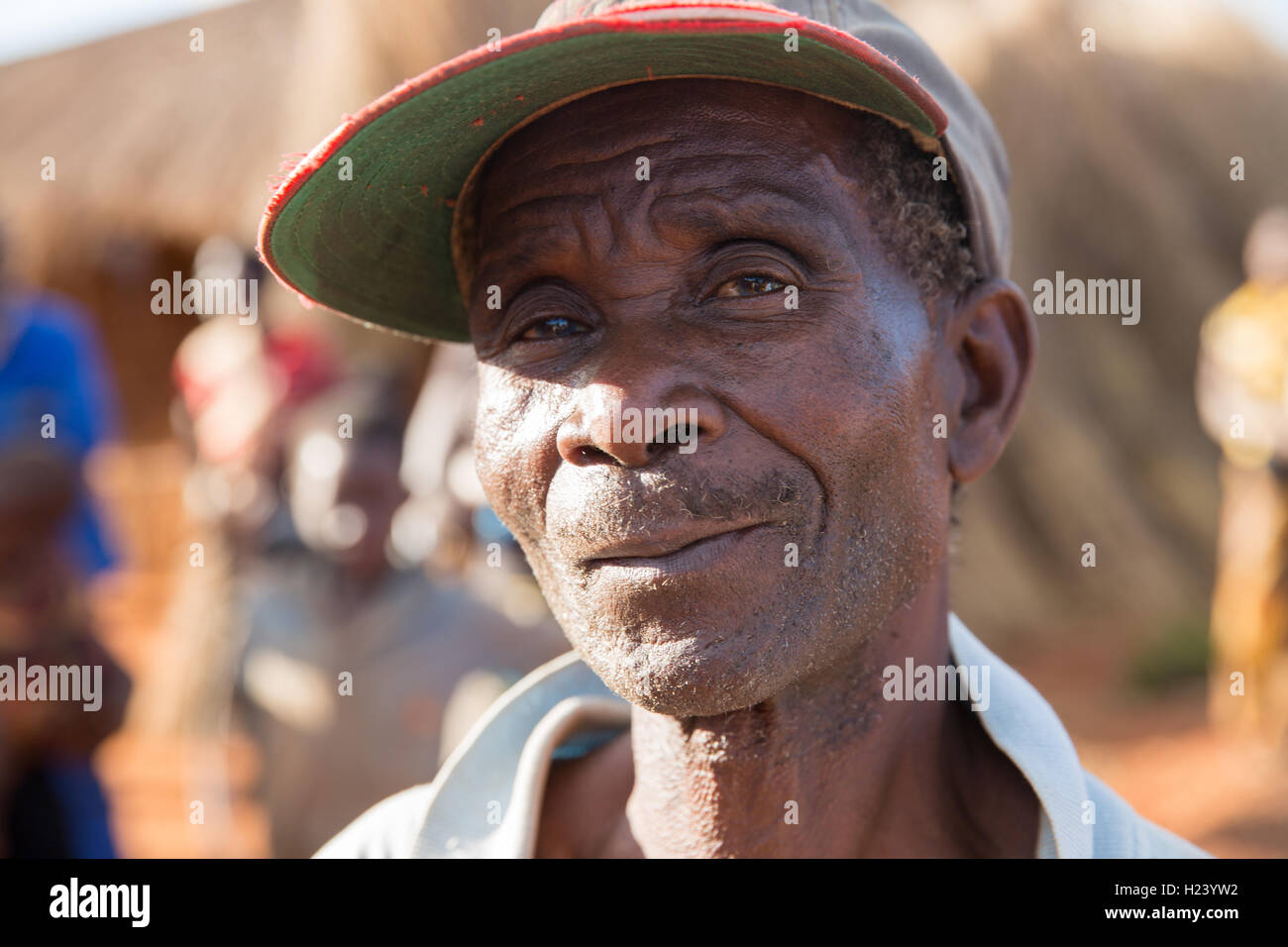 Namina village, Nampula Province, Mozambique, August 2015:  Neighbours of Maria Albino, 42, who has been diagnosed with bilateral cataracts by the Nampula and Ribaue outreach team. She will have her cataratcs removed at Ribaue Hopsital. This project is supported by Sightsavers. Photo by Mike Goldwater Stock Photo