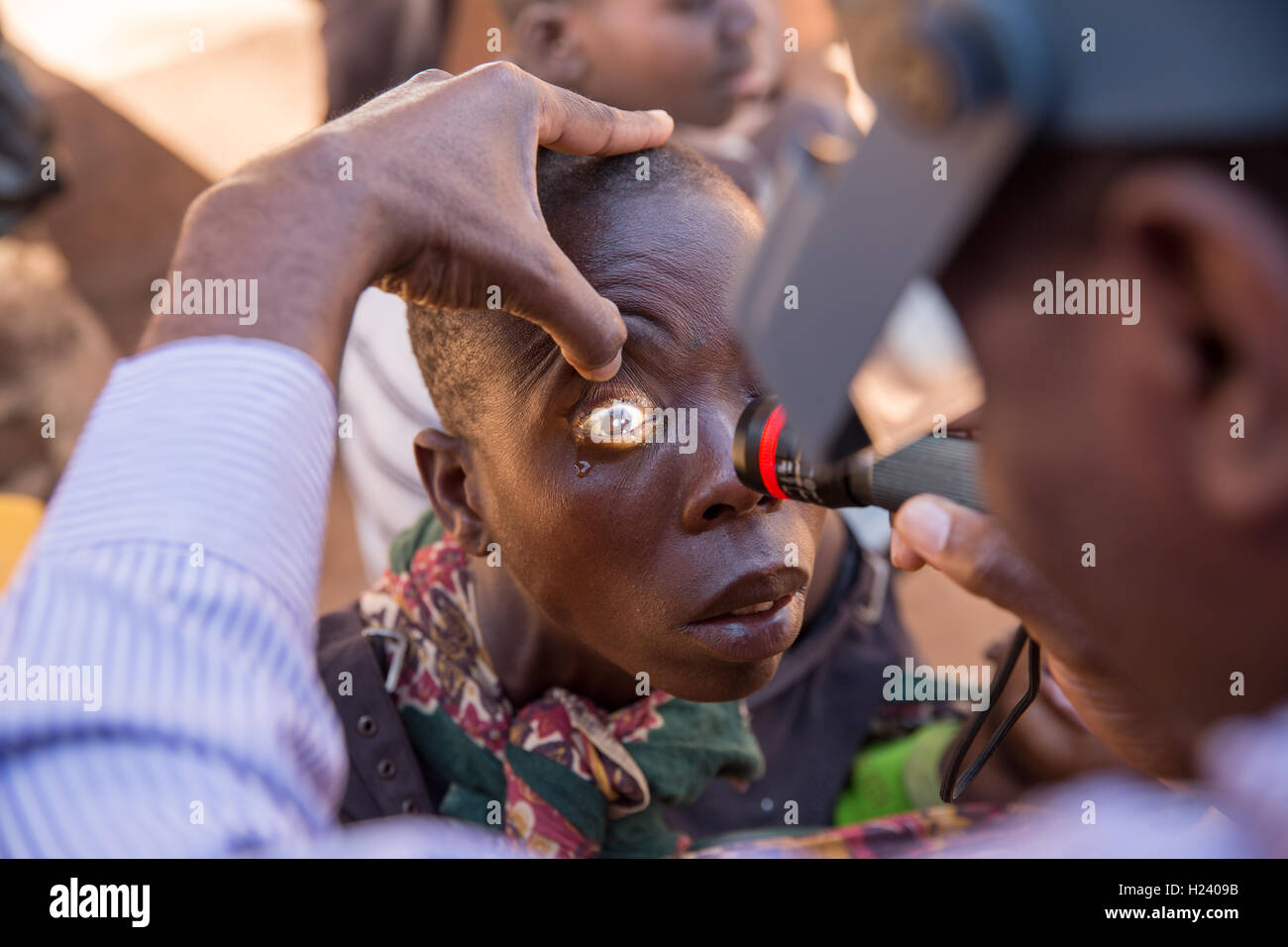 Ribaue Hospital,  Ribaue, Nampula Province, Mozambique, August 2015: Laurinda Diago having having her eyes checked by Ophthamologist Dr Anselmo Vilanculo. Photo by Mike Goldwater Stock Photo