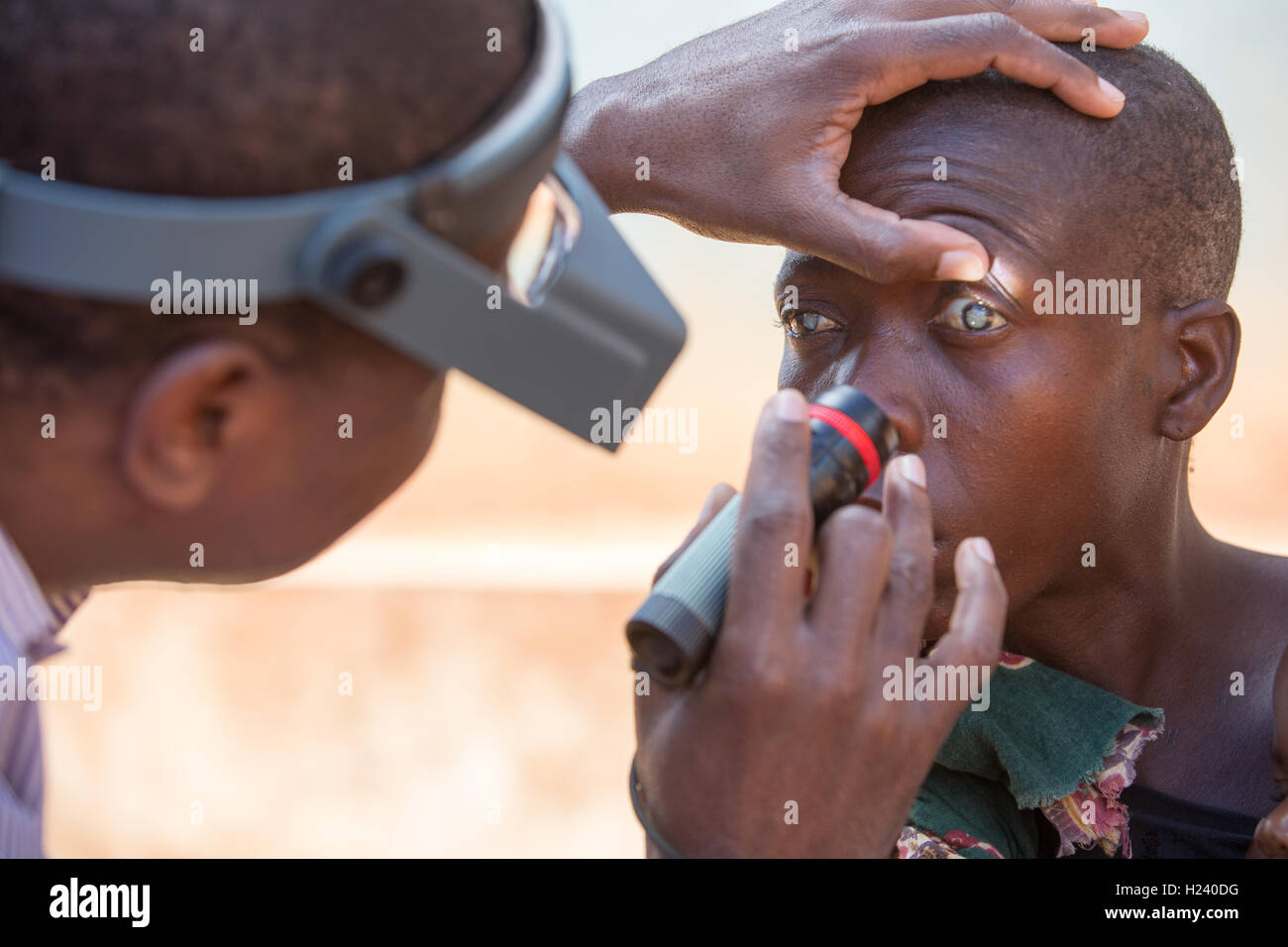 Ribaue Hospital,  Ribaue, Nampula Province, Mozambique, August 2015: Laurinda Diago having having her eyes checked by Ophthamologist Dr Anselmo Vilanculo. Photo by Mike Goldwater Stock Photo