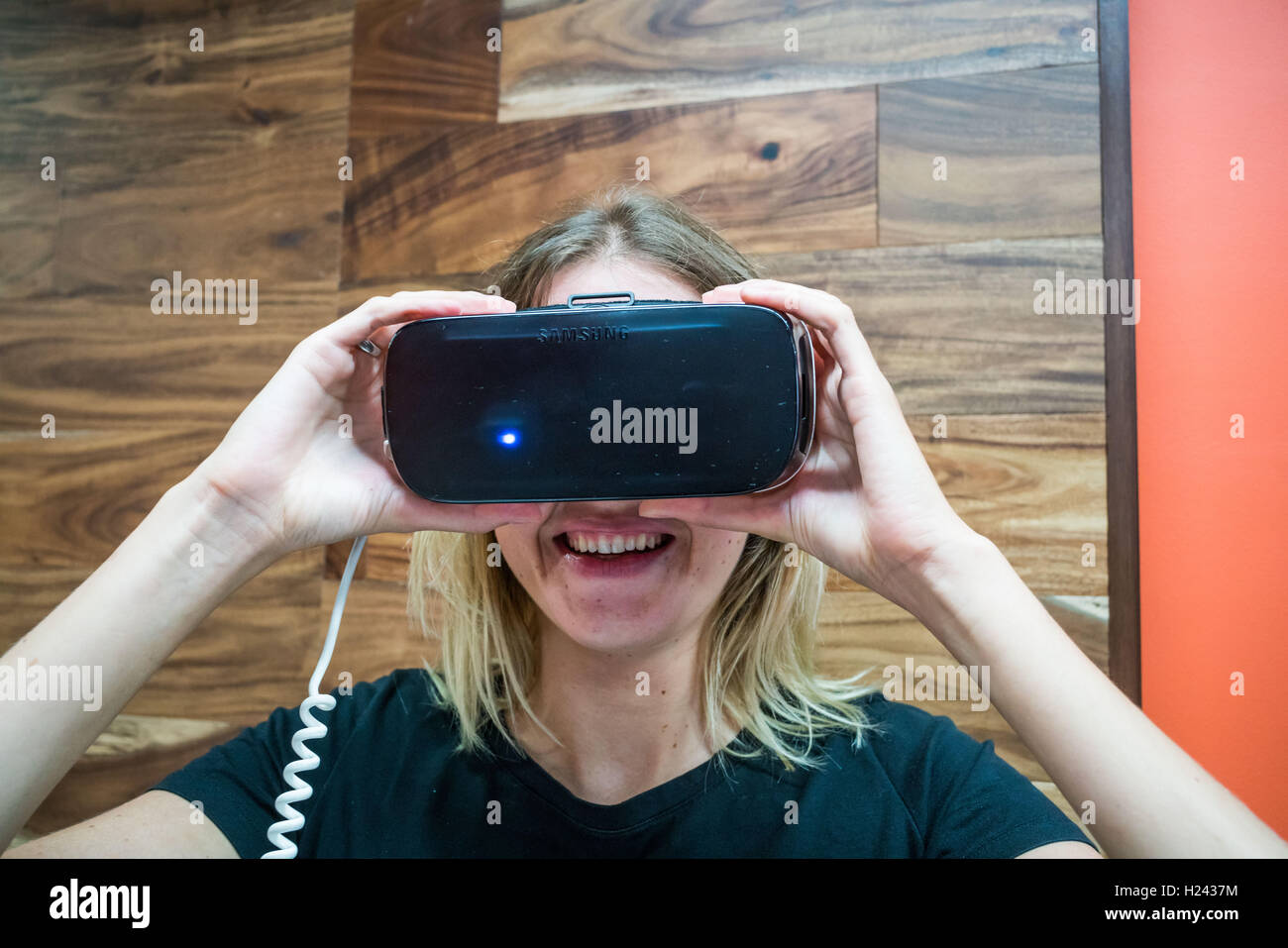 Woman wearing a virtual reality headset. Stock Photo