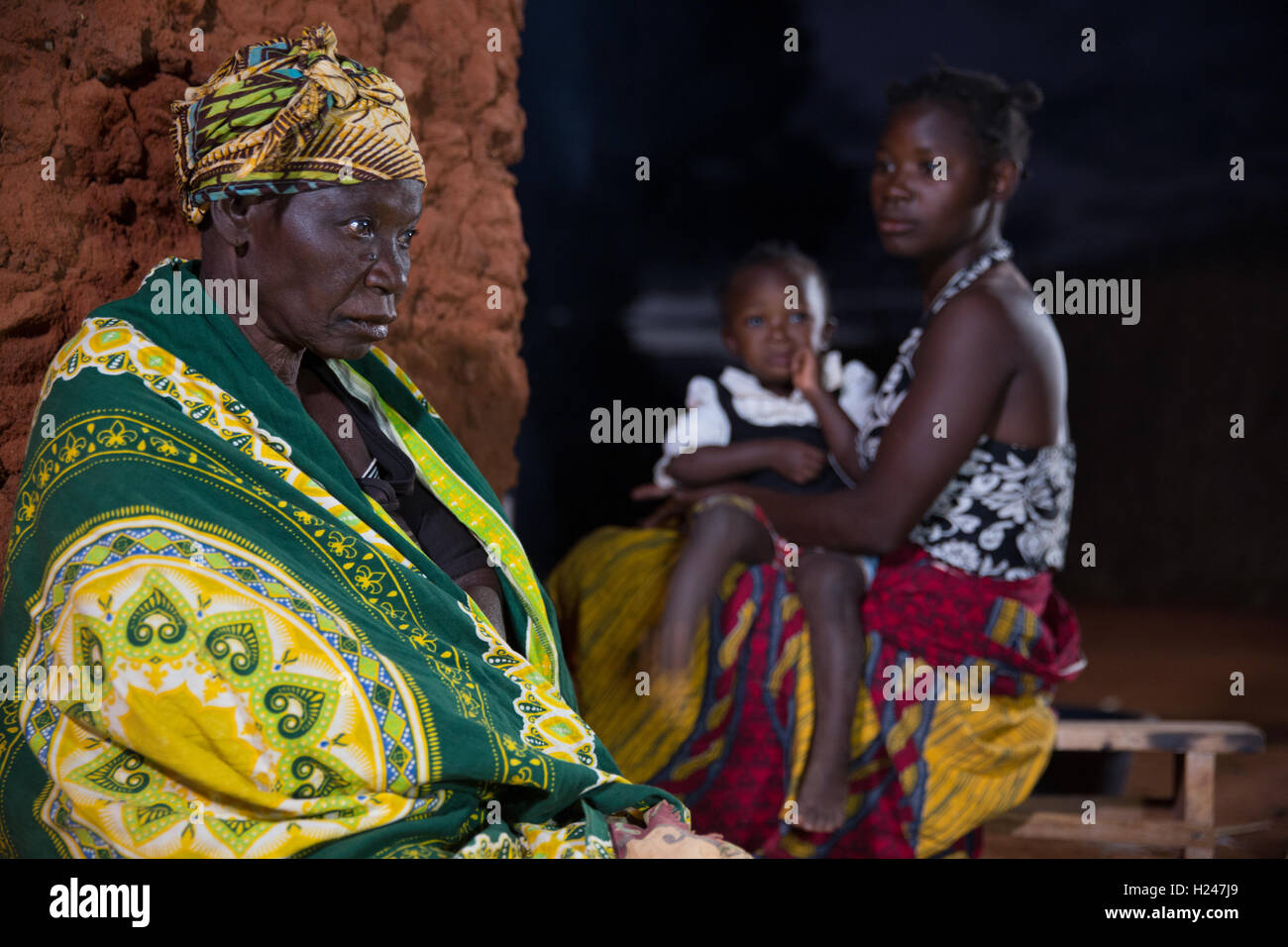 Namina village, Nampula Province, Mozambique, August 2015:  Maria Albino, 42, at home. She is blind with bilateral cataracts and needs help to do most tasks from her 20 year old married daughter Elsa. Photo by Mike Goldwater Stock Photo