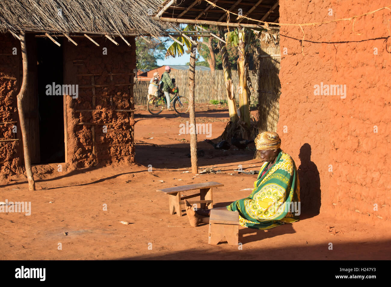 Namina village, Nampula Province, Mozambique, August 2015:  Maria Albino, 42, at home. She is blind with bilateral cataracts and needs help to do most tasks from her 20 year old married daughter Elsa and her sister Louisa.  Photo by Mike Goldwater Stock Photo