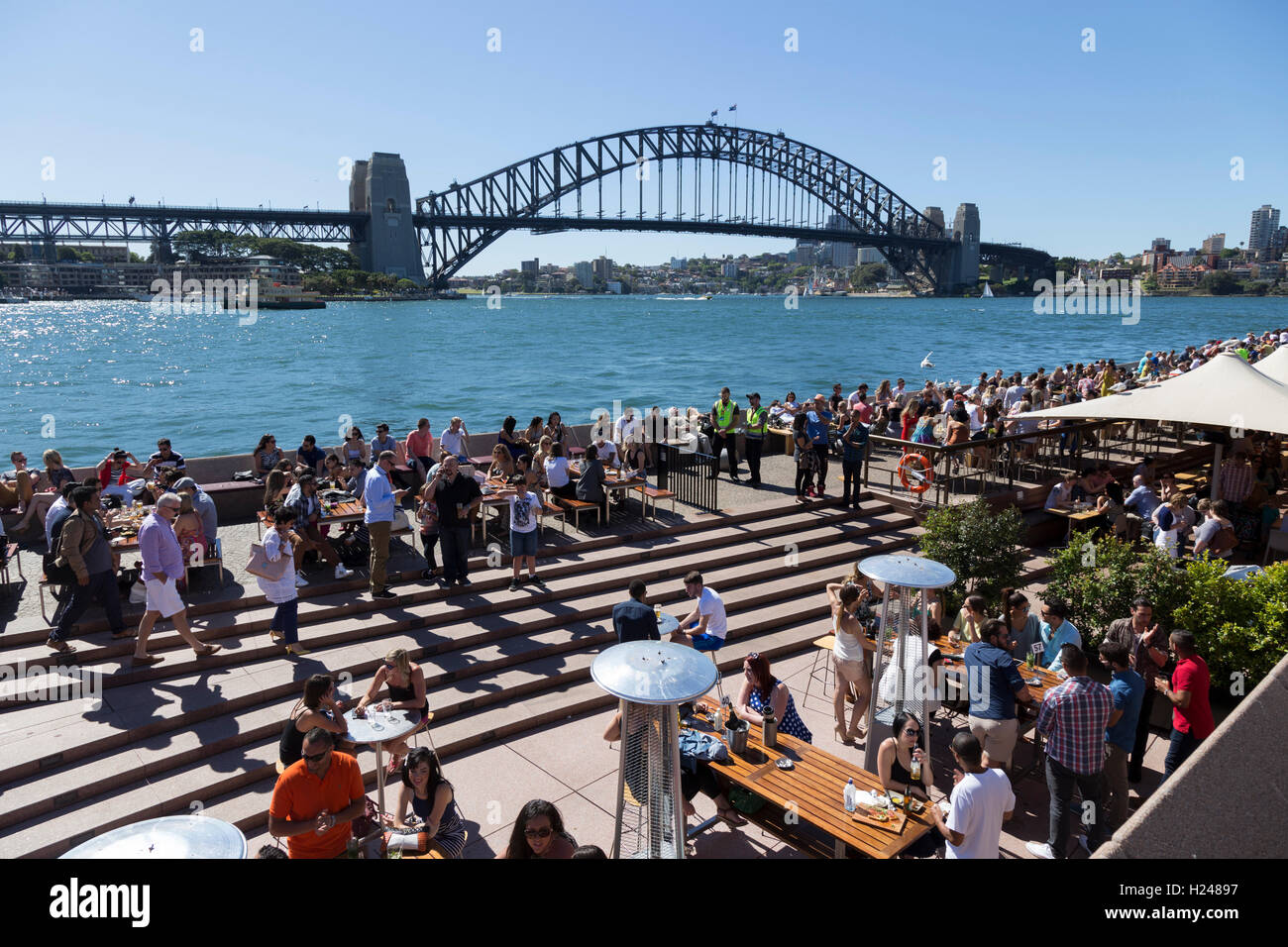 Café bar near Sydney Opera House packed with locals and tourists on a