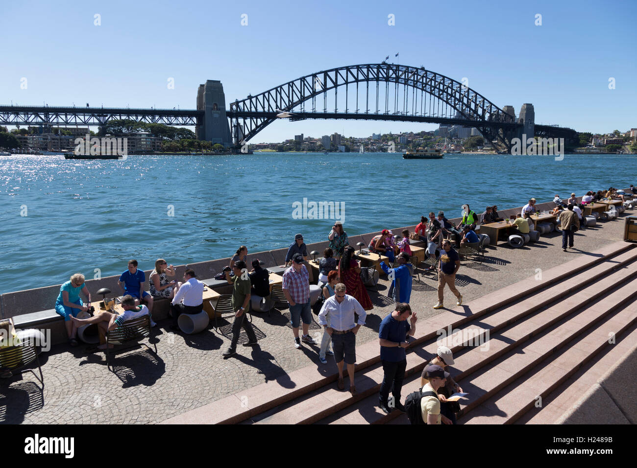 Café bar near Sydney Opera House packed with locals and tourists on a