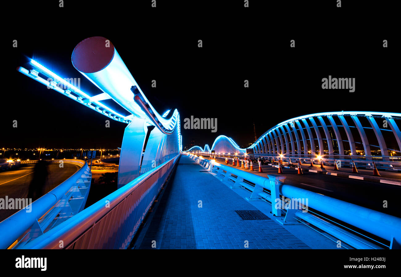 Dubai, UAE, 23rd September, 2016: Meydan bridge outside Meydan race track,  illuminated at night Stock Photo