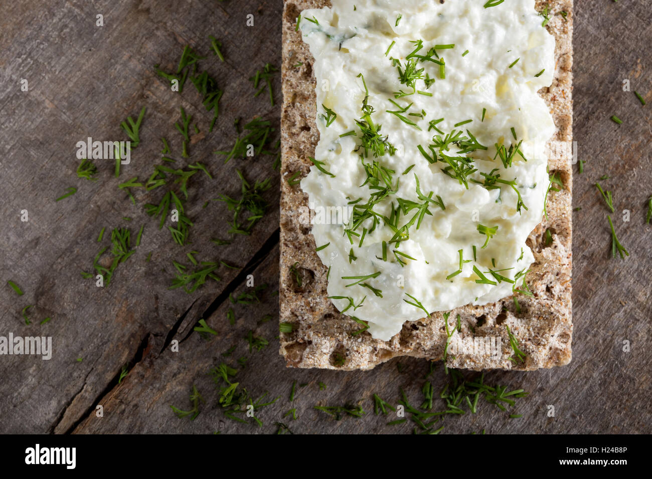 Crisp bread sandwich with cream cheese and fresh herbs Stock Photo