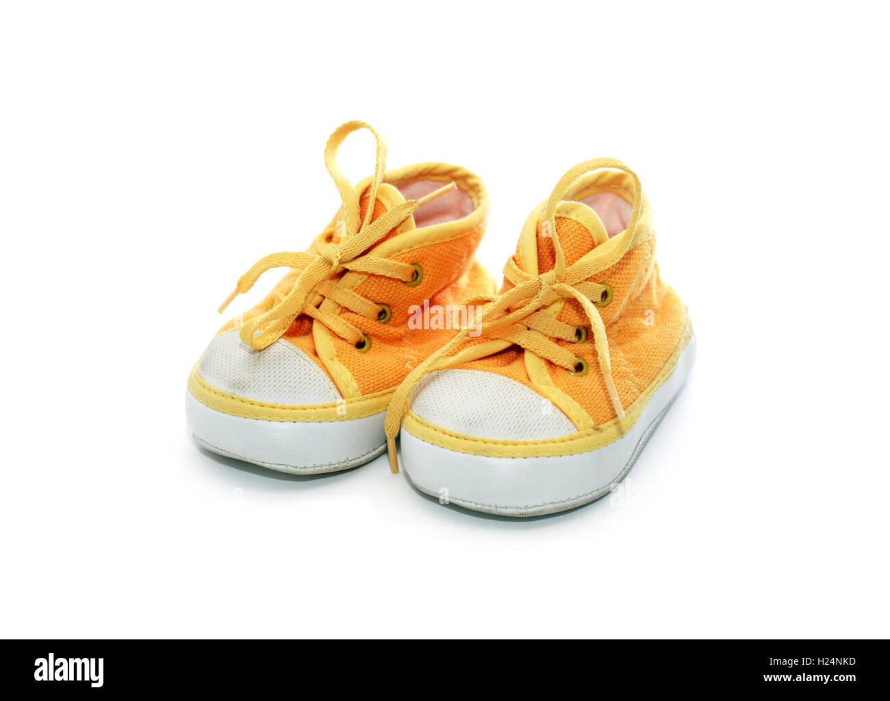 Nice yellow baby shoes on white background Stock Photo Alamy