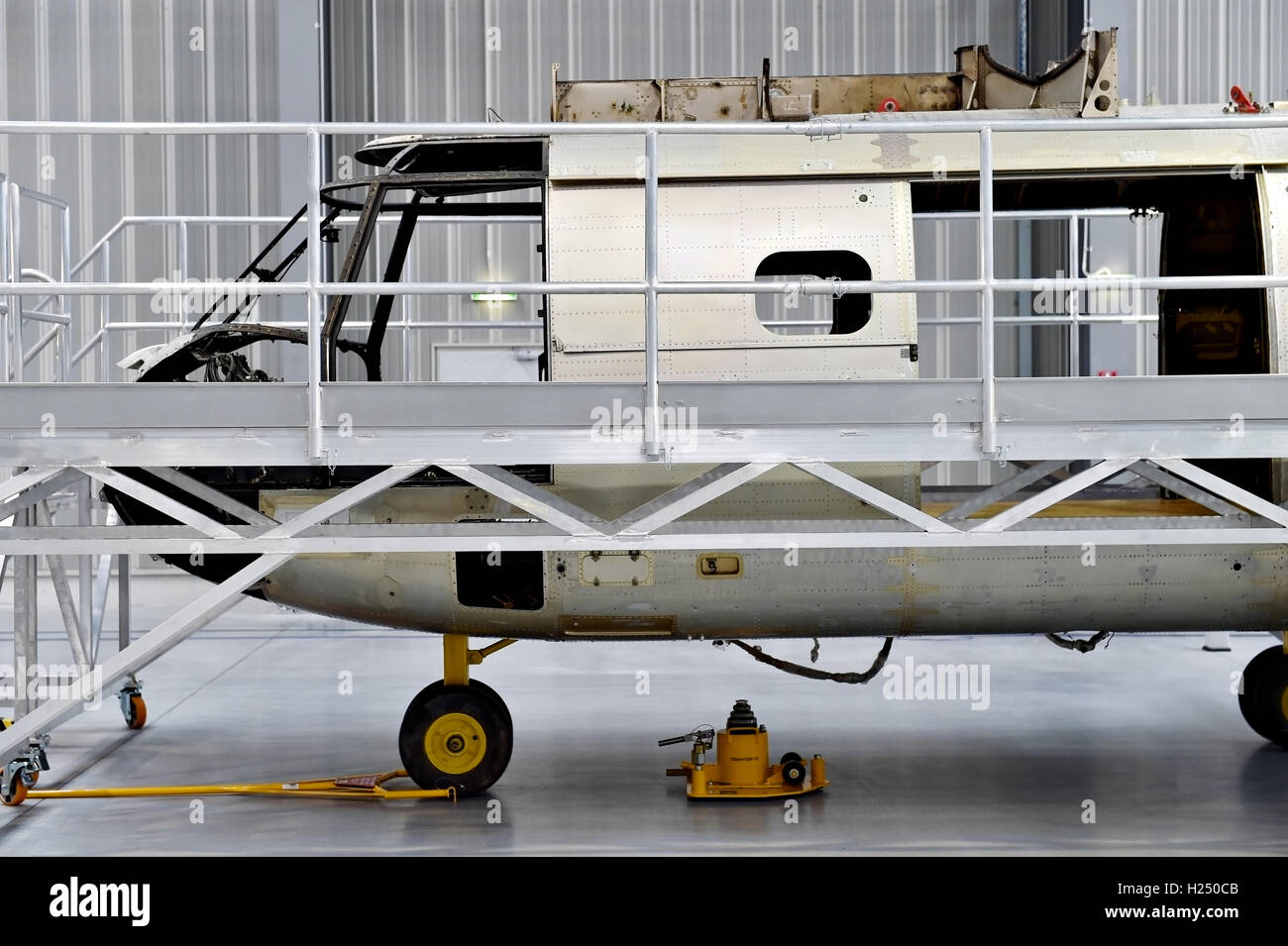 Detail with helicopter fuselage on the repair line in a factory Stock Photo