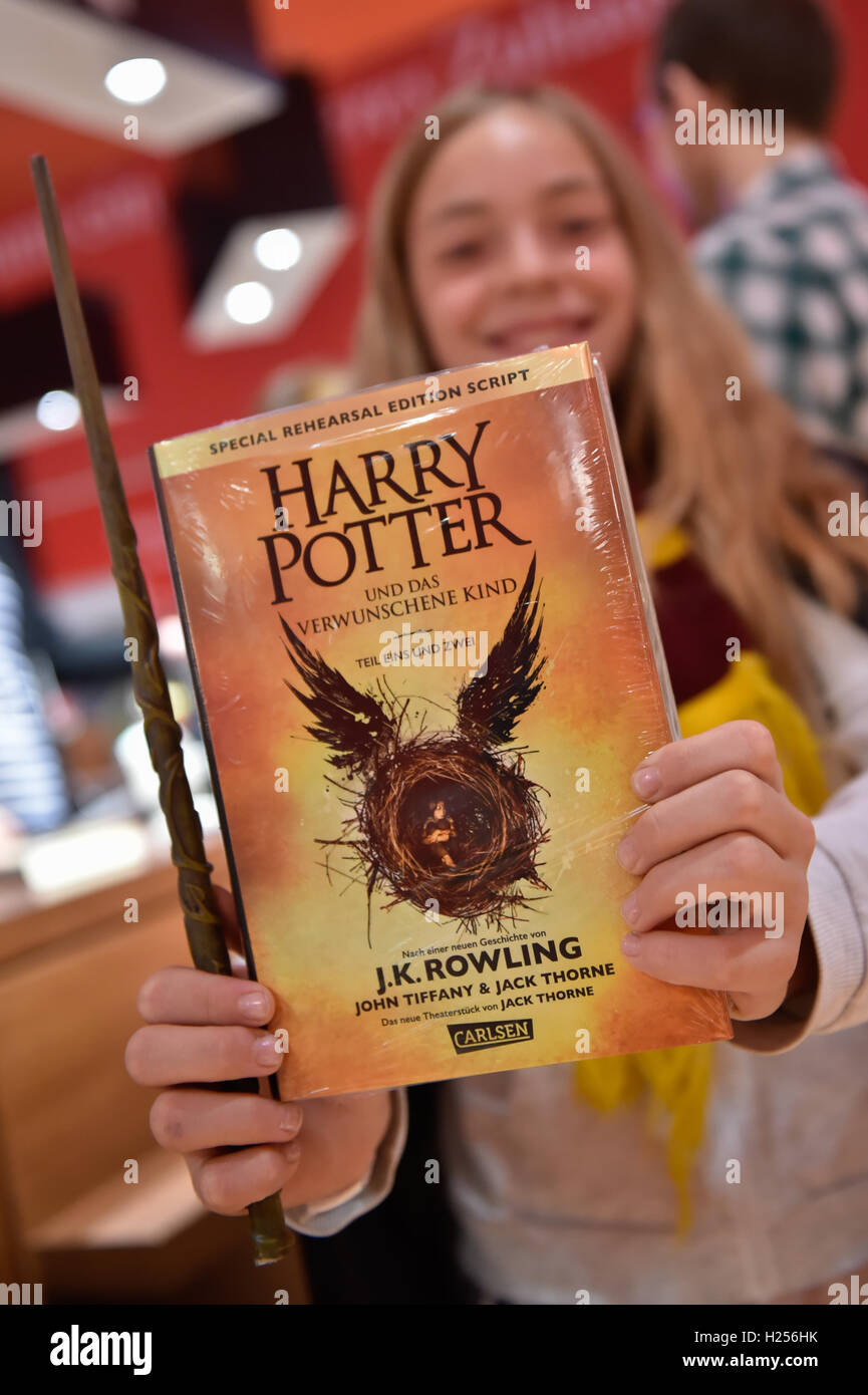 Berlin, Germany. 24th Sep, 2016. Eleven-year-old Kaya from Berlin holds up her new Harry Potter book at the Kulturkaufhaus Dussmann in Berlin, Germany, 24 September 2016. The book entitled 'Harry Potter and the Cursed Child' has been available since midnight. Photo: KLAUS-DIETMAR GABBERT/dpa/Alamy Live News Stock Photo