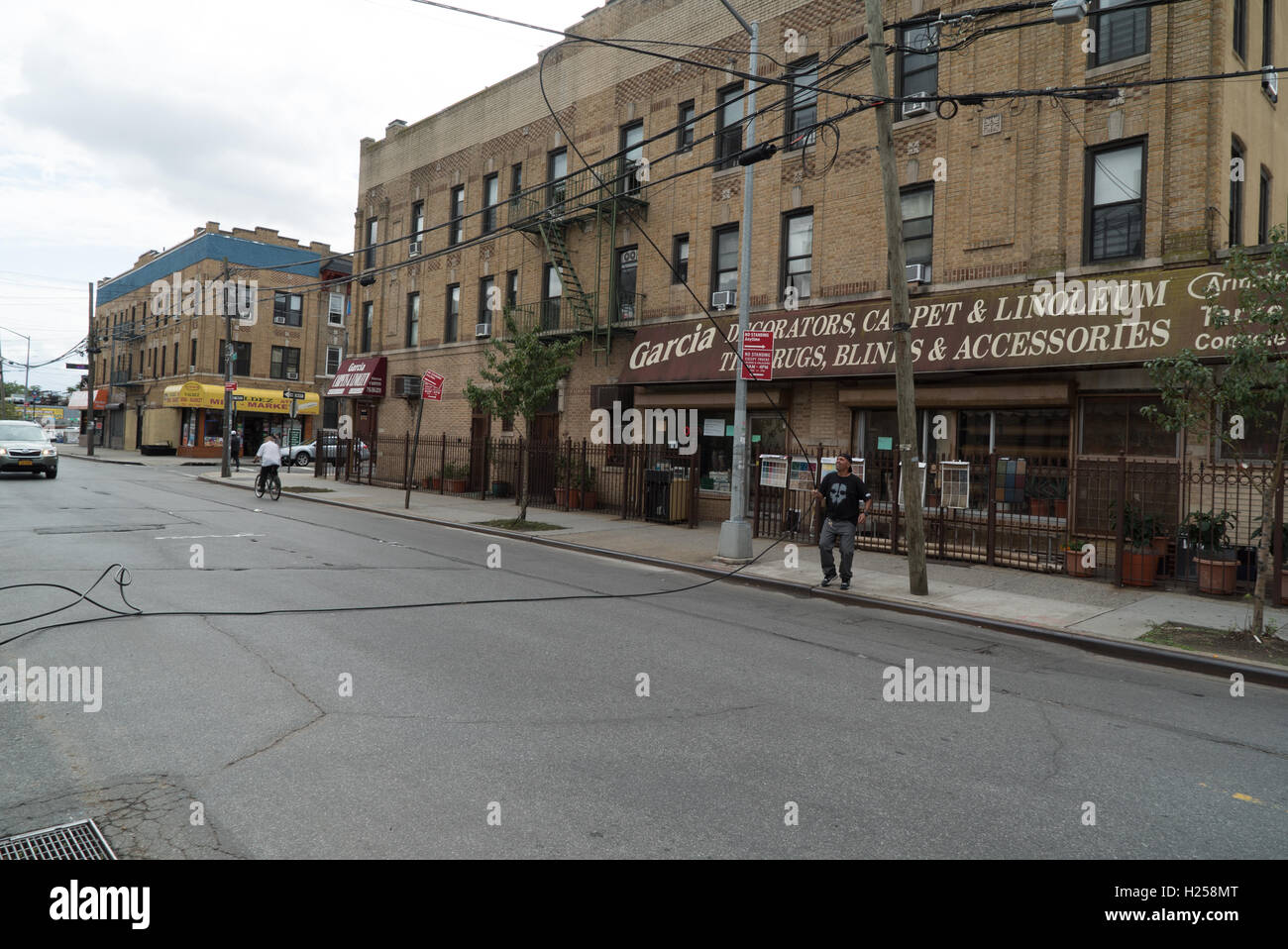 Ridgewood, USA, Sept. 24st, man dragging cable off the street