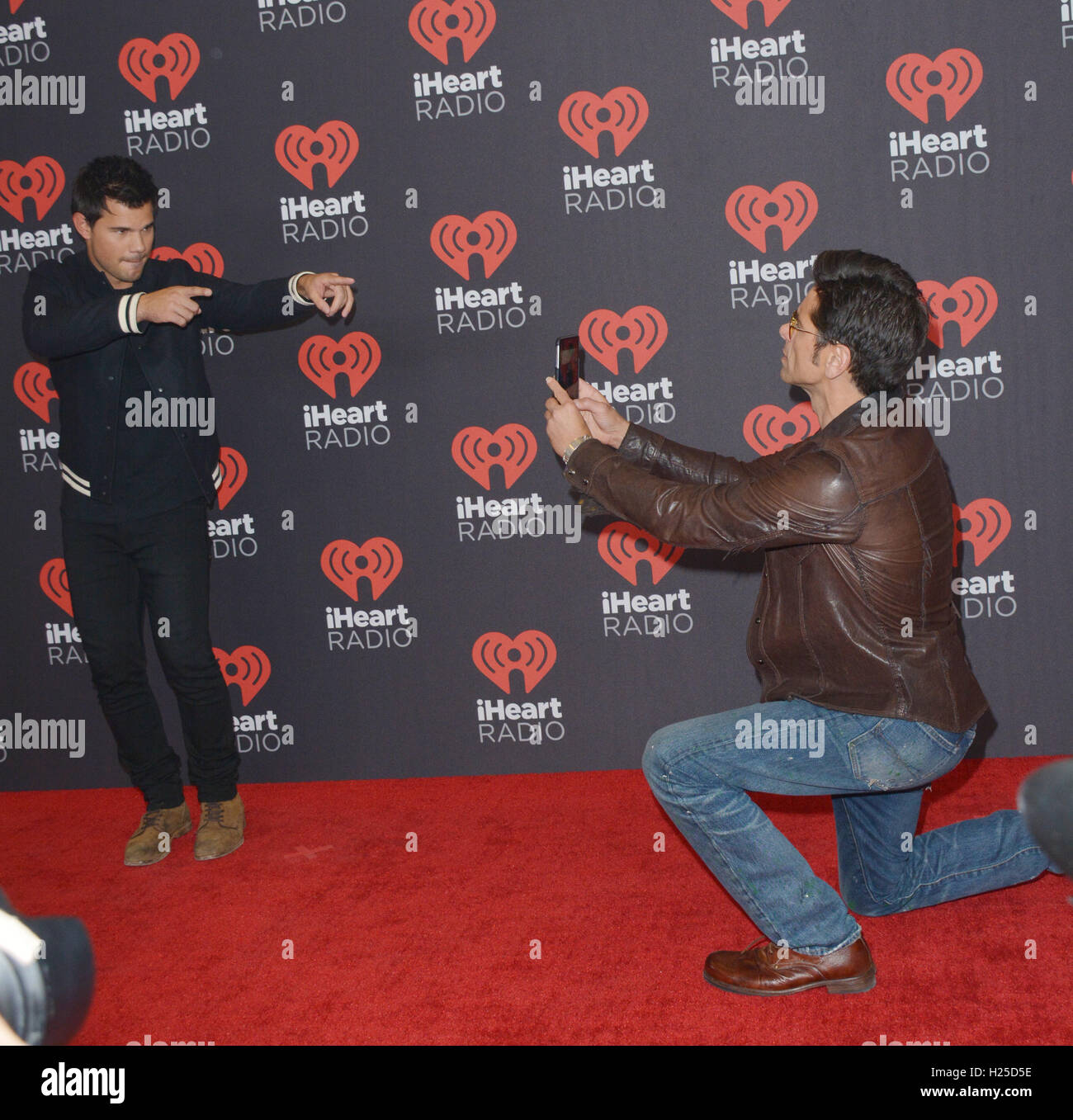Las Vegas, Nevada, USA. 24th Sep, 2016. Actors Taylor Lautner anf John Stamos attend the iHeartRadio Music Festival on September 24, 2016 at the T-Mobile Arena in Las Vegas, Nevada. Credit:  Marcel Thomas/ZUMA Wire/Alamy Live News Stock Photo