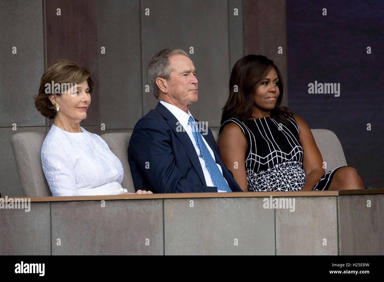 Laura Bush, President George W. Bush and First Lady Michelle Obama listen as President Barack Obama gives remarks during the opening ceremony of the Smithsonian National Museum of African American History and Culture September 24, 2016 in Washington, D.C. The Bonner Family are fourth generation descendants of Ellijah B. Odom, a young slave who escaped to freedom. Stock Photo
