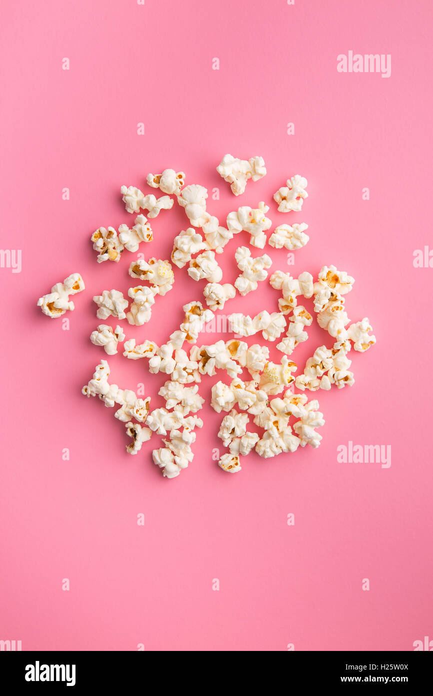 The popcorn on pink background. Stock Photo