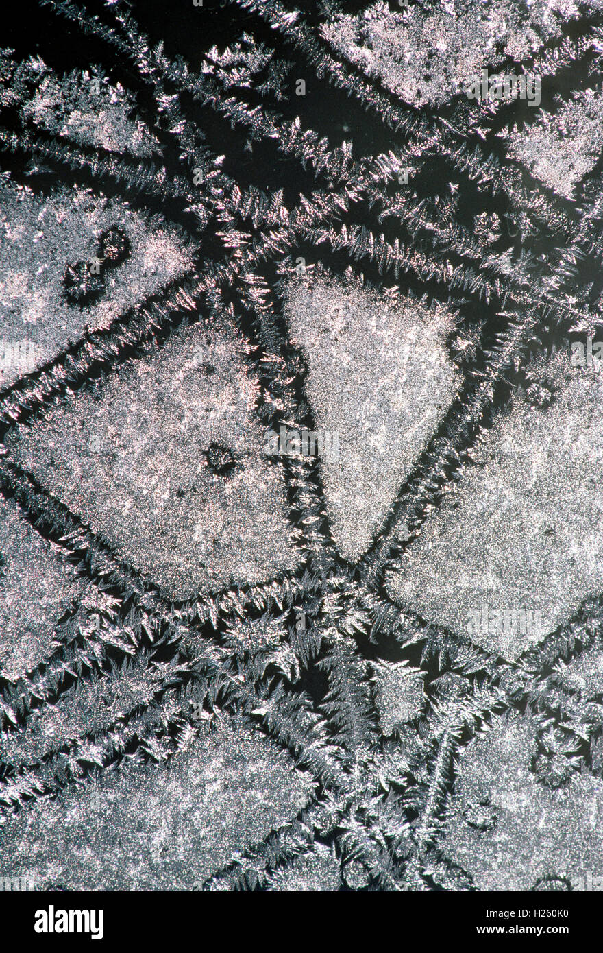 Frost crystals create patterns on a window Stock Photo - Alamy