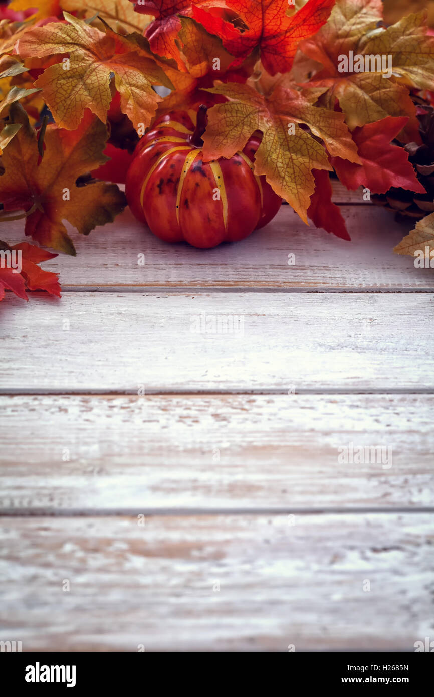 Autumn background with colored leaves on white wooden board Stock Photo ...