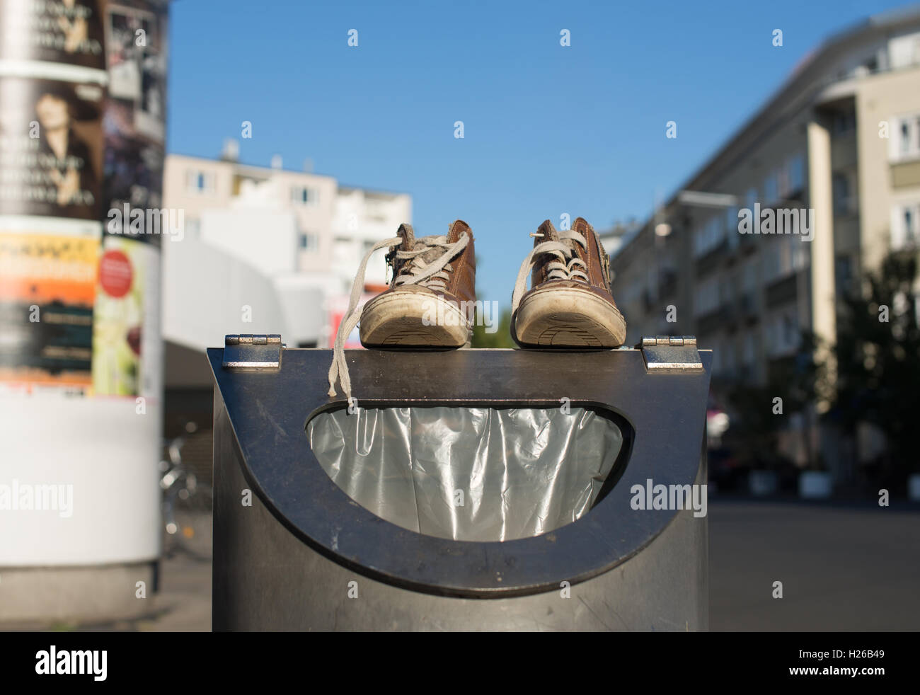 Shoes on a garbage can Stock Photo