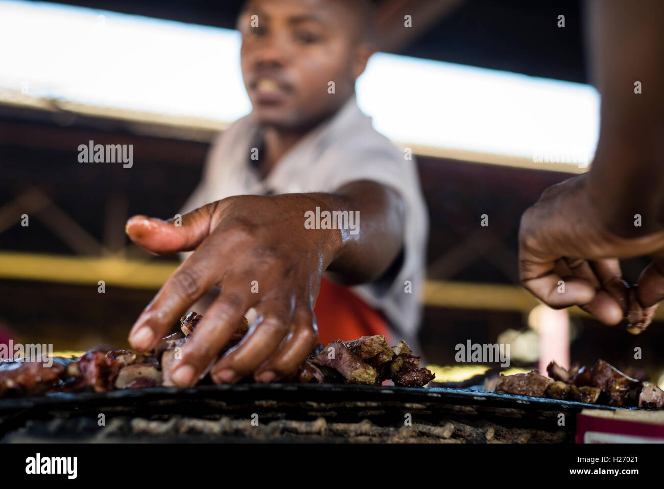 A Kapana man calls for customers at Katutura open market, Windhoek