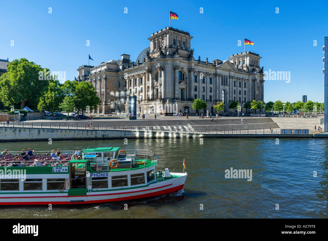 River cruise boat on the Spree River in front of the Reichstag building, Mitte, Berlin, Germany Stock Photo