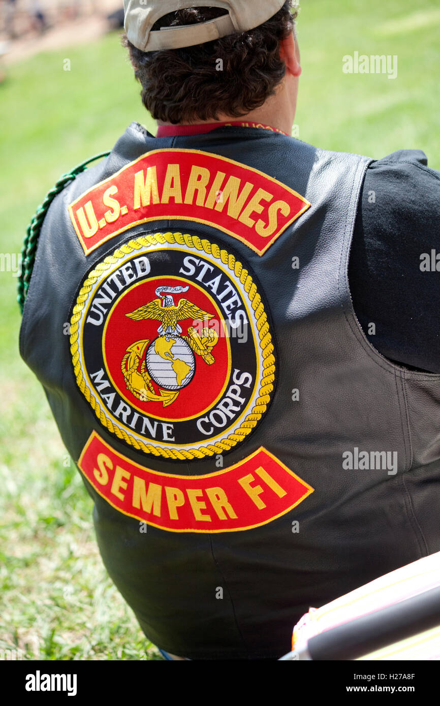 Man wearing a vest with a U.S. Marines Semper Fi Marine Corps symbol on the back. St Paul Minnesota MN USA Stock Photo