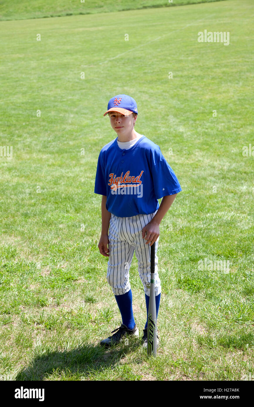 Boy in cheap baseball uniform