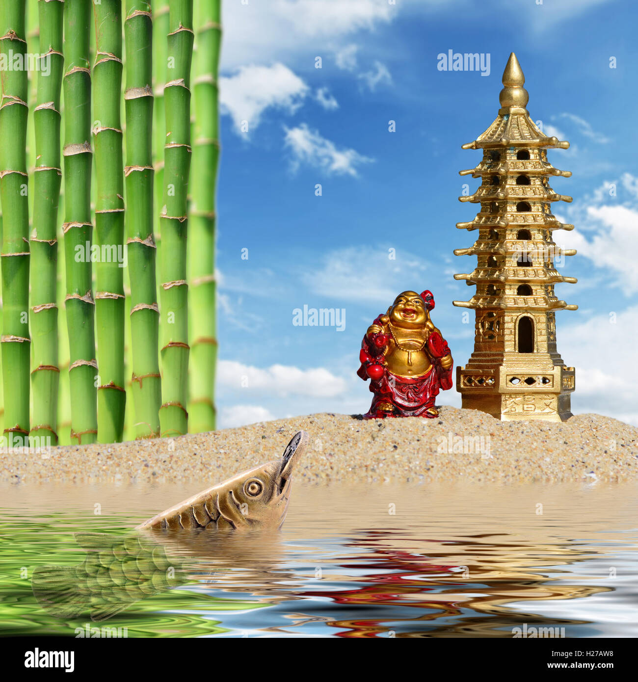 Laughing Buddha,bamboo,arowana with coin and seven-storied pagoda reflected in the water.Symbol of wealth and great fortune Stock Photo