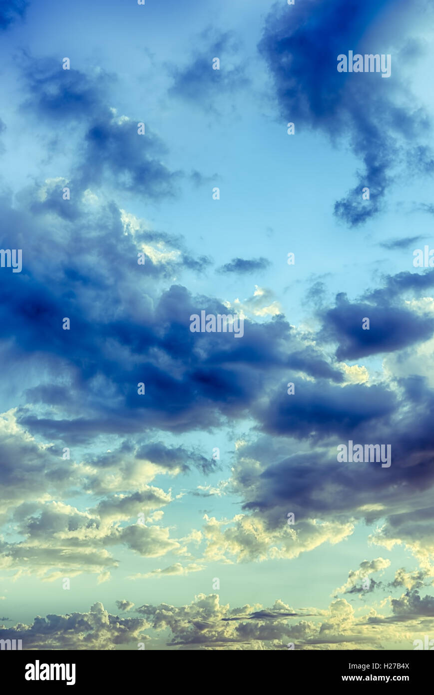 Beautiful blue sky with cumulus clouds at sunset. HDR photo Stock Photo ...