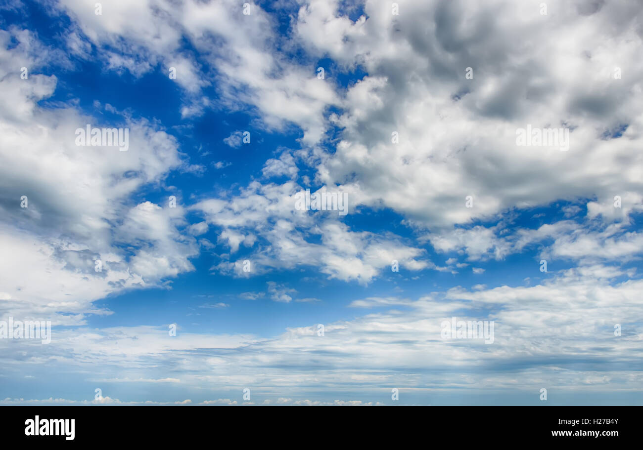 Beautiful blue sky with cumulus clouds at sunset. HDR photo Stock Photo ...
