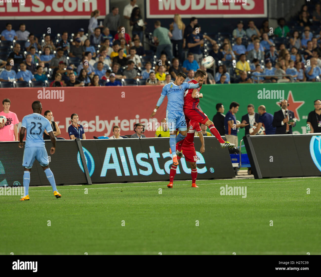 New York, NY USA - September 23, 2016: Ronald Matarrita (22) 0f NYCFC & Luis Solignac (9) of Chicago Fire fight for air ball during MLS game NYCFC won 4 - 1 Stock Photo