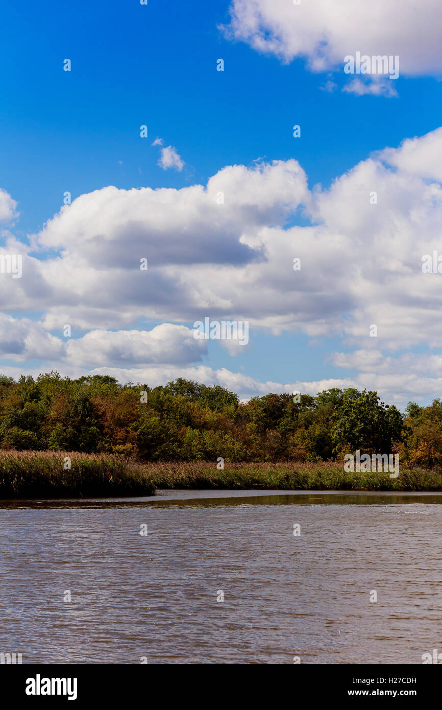 reflections of clouds and blue sky Stock Photo - Alamy