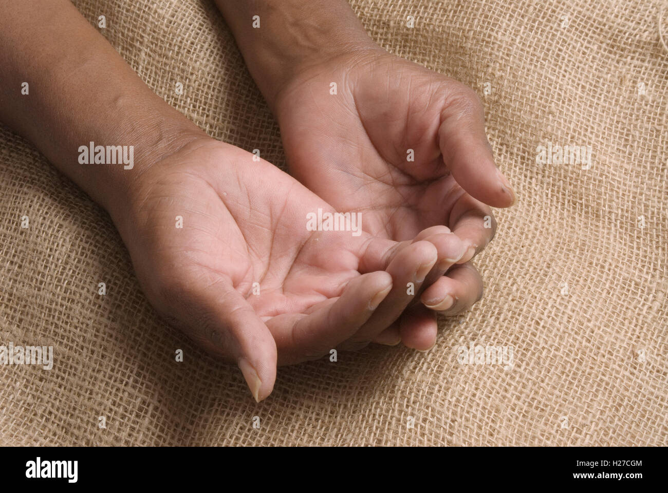 African's open hands begging or asking Stock Photo