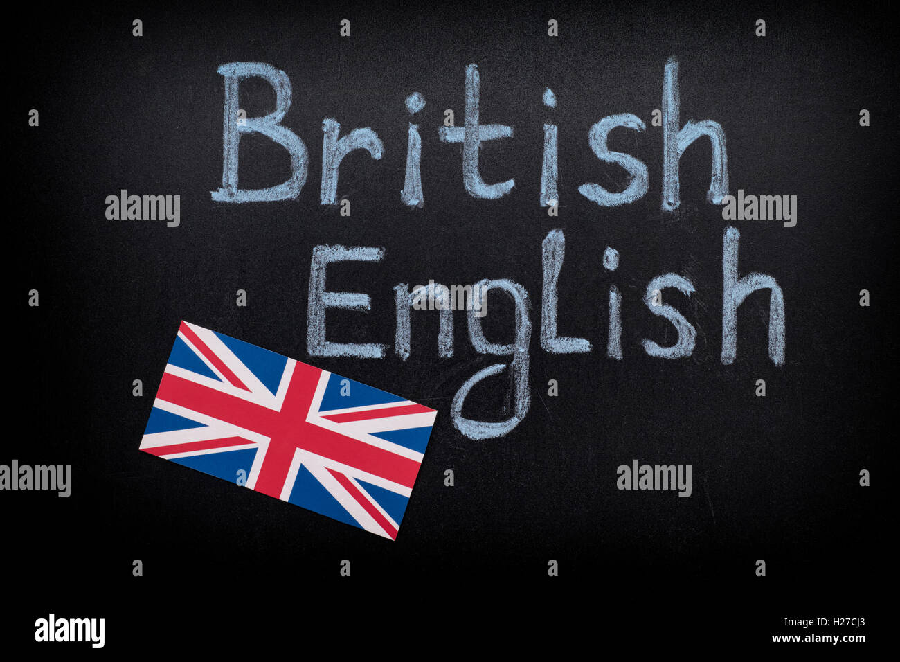 British English on blackboard. Close up. Stock Photo
