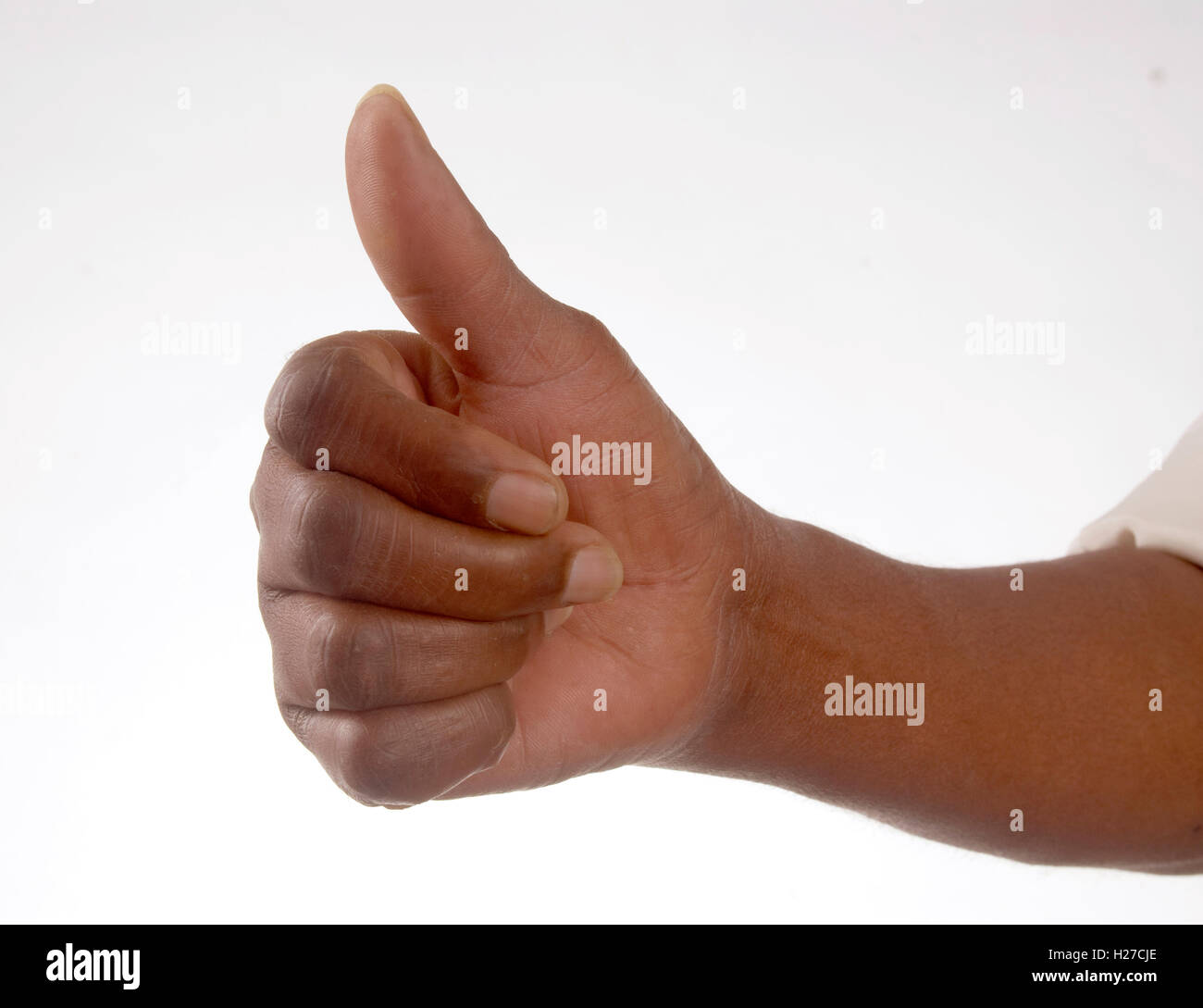 African's hand giving the thumb's up sign Stock Photo