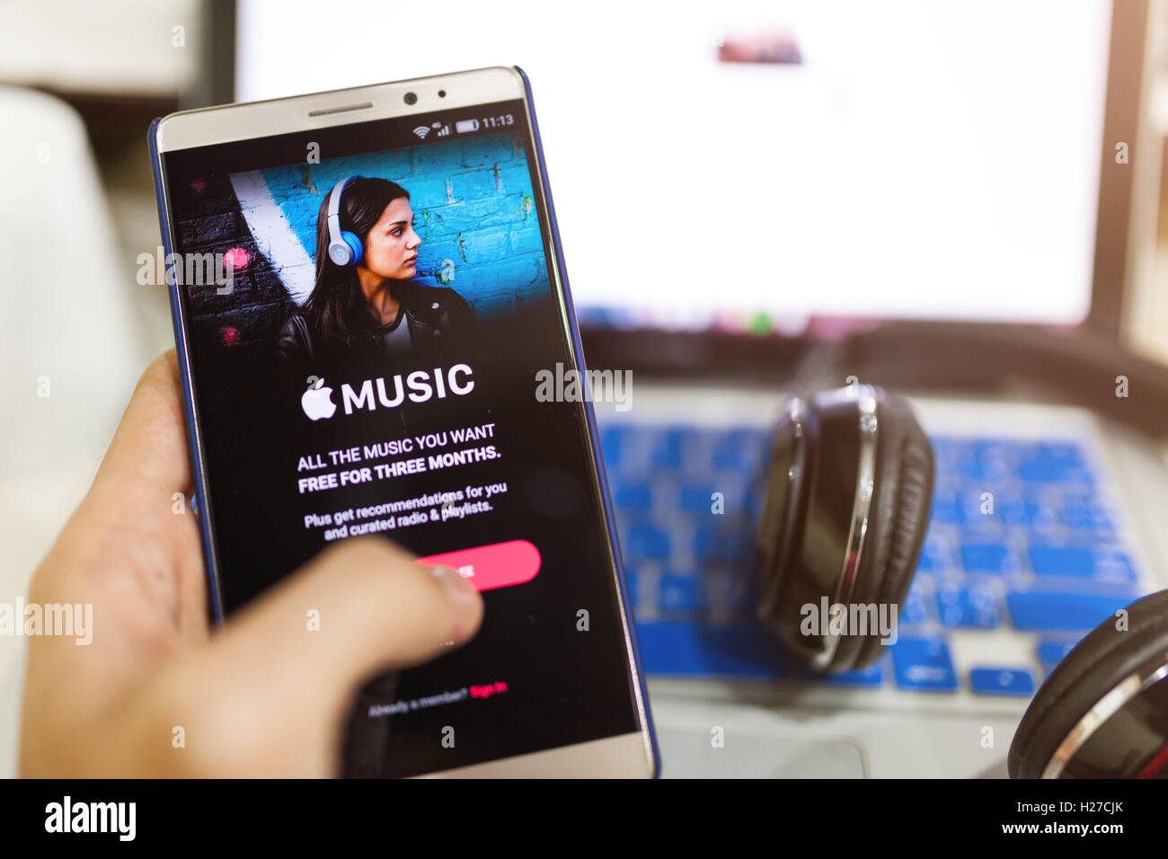 CHIANG MAI,THAILAND - Sept 25,2016: A man hand holding screen shot of Apple music app showing on Android. Apple Music is the new Stock Photo