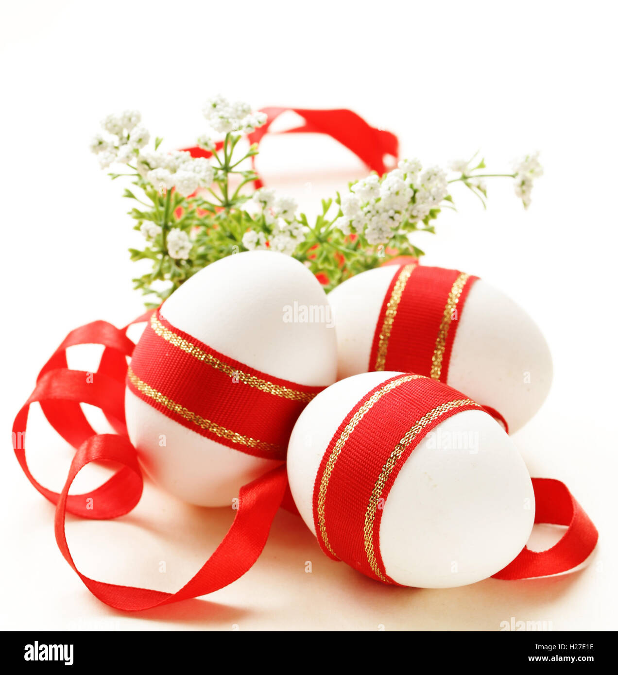 Easter egg decorated with red ribbon Stock Photo - Alamy