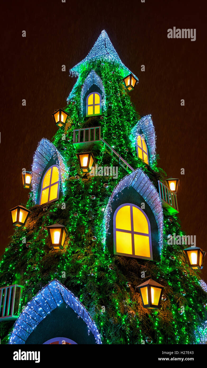 Main Lithuanian Christmas tree located at the Cathedral Square in Vilnius, Lithuania. The tree is designed as the big and cozy house where people can go inside and listen to fairy tales. Stock Photo