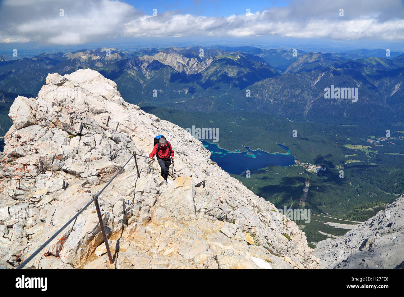 Hiker near the summit of Zugspitze Mountain, the highest in Germany. Stock Photo
