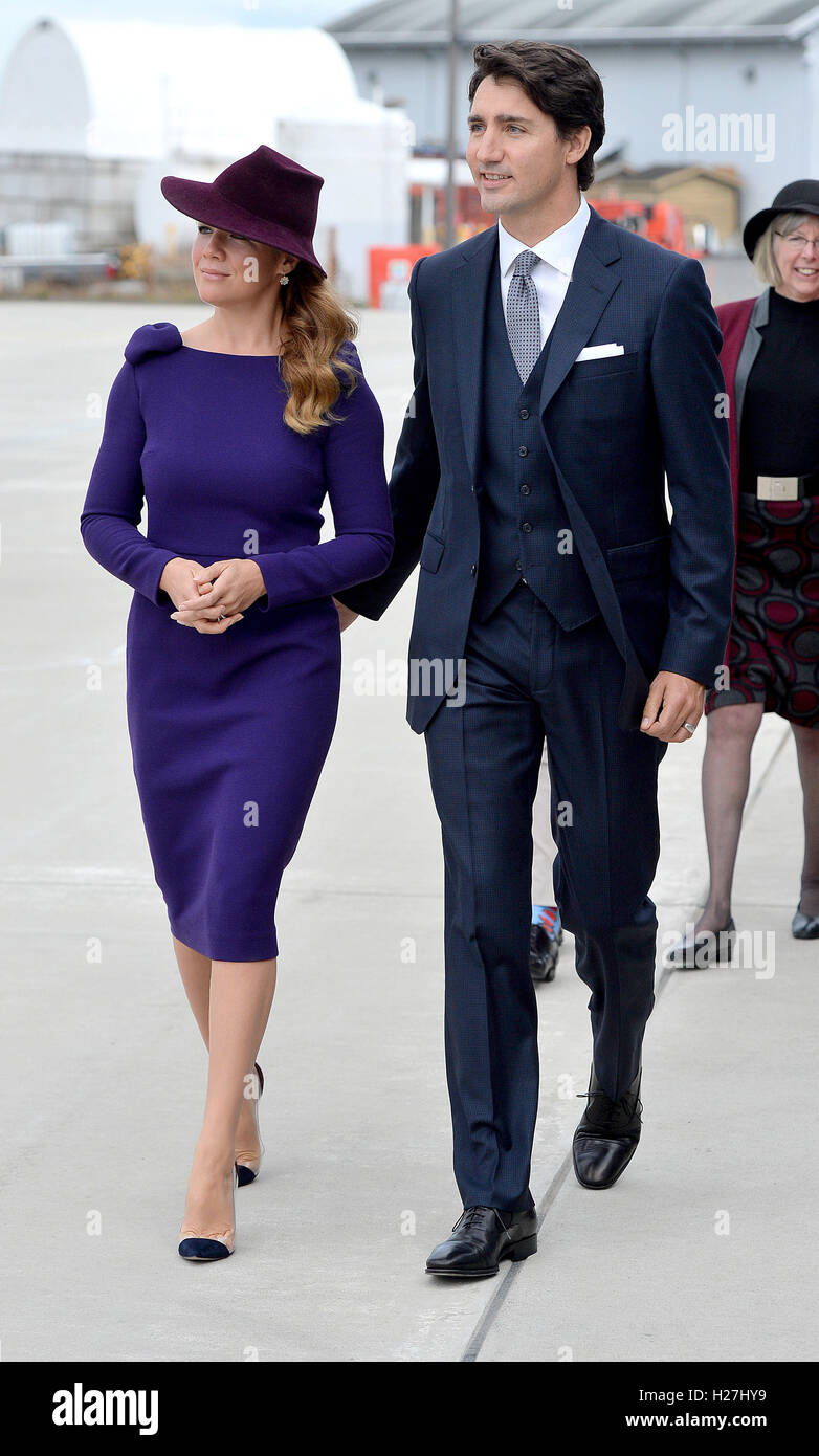 The Prime Minister of Canada Justin Trudeau and his wife Sophie walk to greet the Duke and Duchess of Cambridge and their children Prince George and Princess Charlotte, as the Royal party arrive at Victoria International Airport, in Victoria, Canada, on the first day of their official tour of Canada. Stock Photo