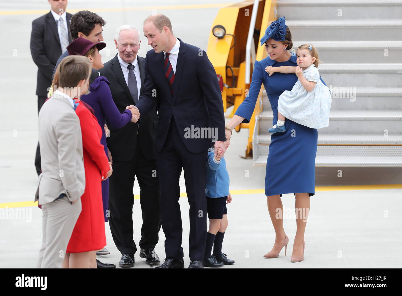 The Prime Minister of Canada Justin Trudeau (fourth left) and his wife Sophie (third left) greet the Duke and Duchess of Cambridge and their children Prince George and Princess Charlotte, as the Royal party arrive at Victoria International Airport, in Victoria, Canada, on the first day of their official tour of Canada. Stock Photo