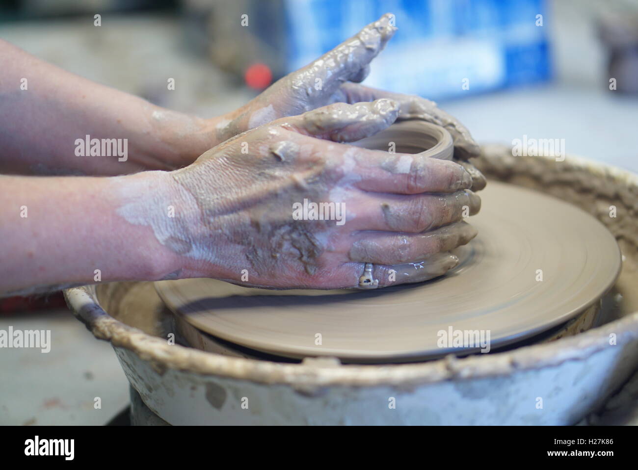 Close-up of female mature student's hands during a pottery class Stock Photo