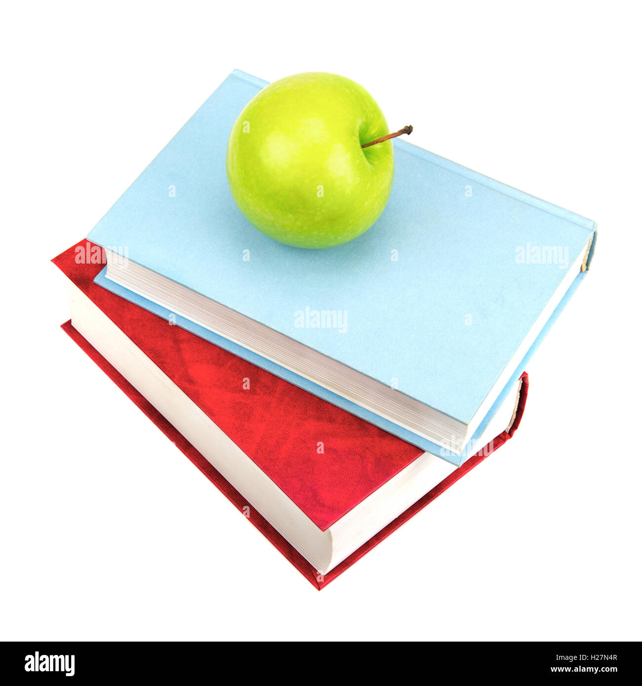 Books and green apple isolated on white background Stock Photo - Alamy