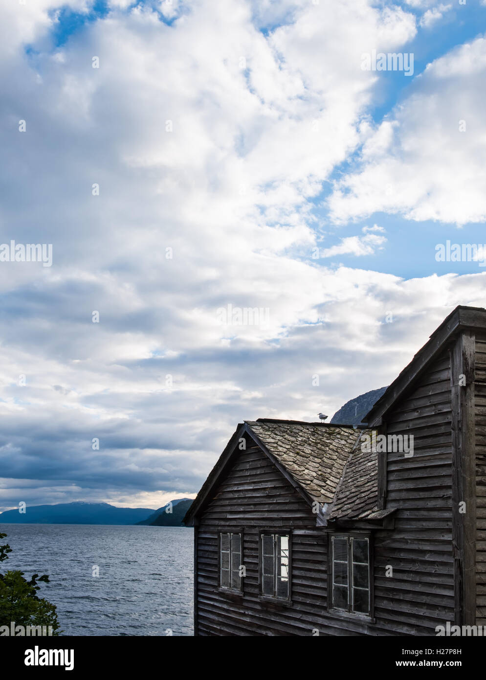 Old norwegian traditional house near Hardangerfjord fjord Stock Photo