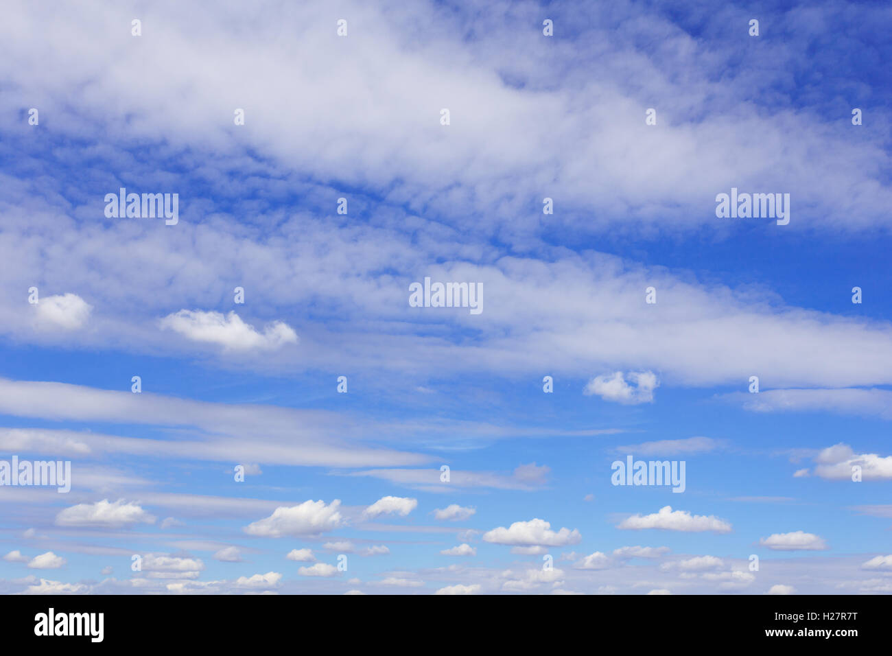 Blue sky with lots of white clouds Stock Photo - Alamy