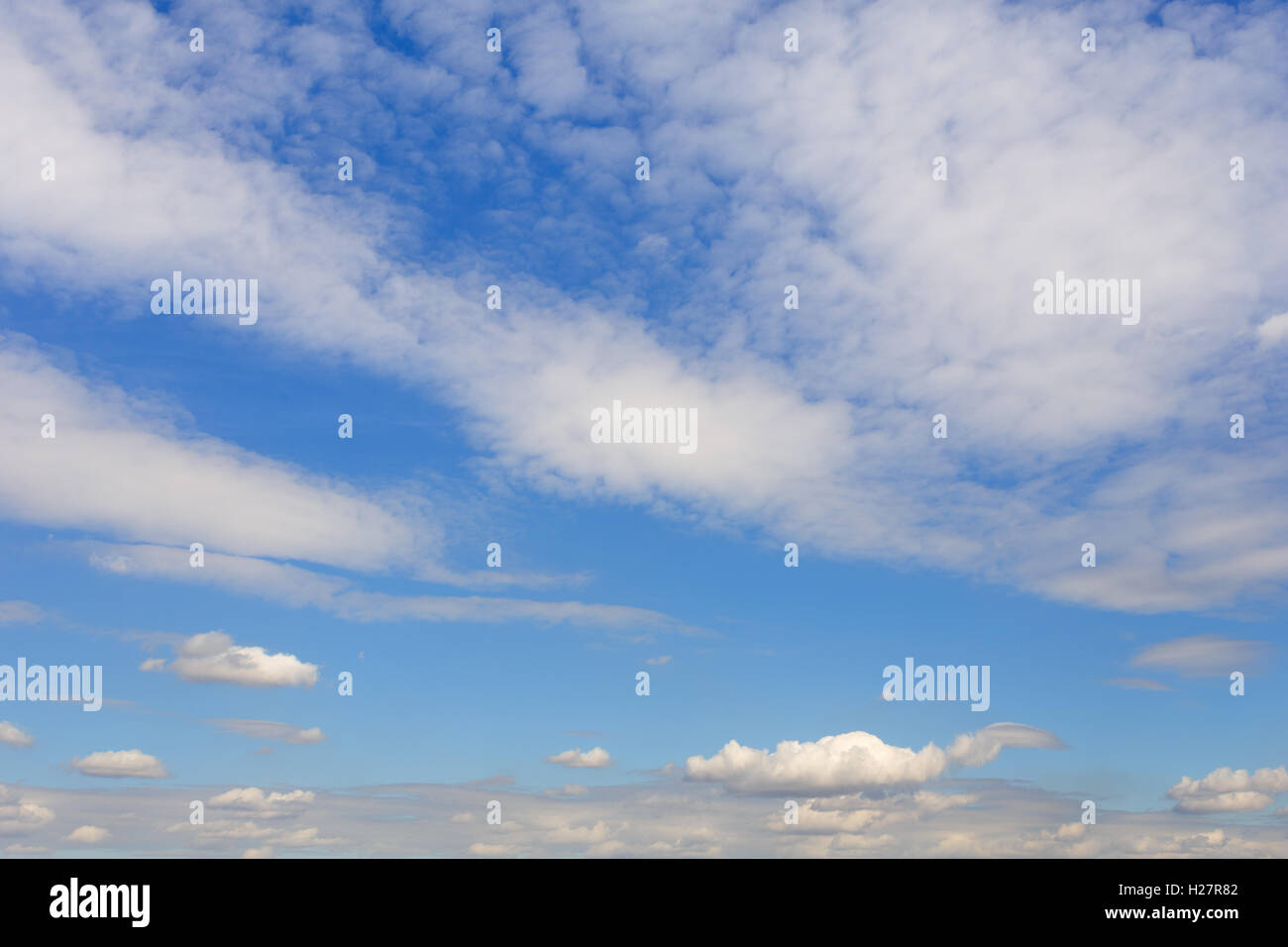 Blue sky with lots of white clouds Stock Photo - Alamy